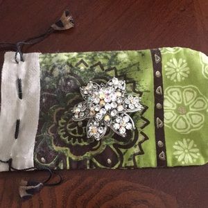 Chico’s iridescent stone pin with storage bag.